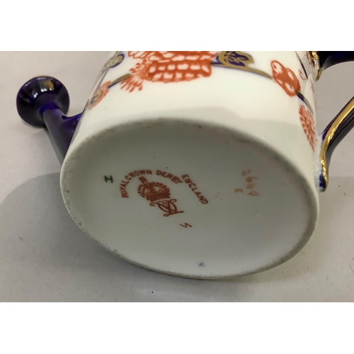 187 - A Royal Crown Derby miniature watering can together with various pill boxes in metal and pottery, tw... 