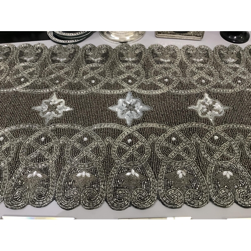 193 - A five light silver plated candelabra, diamante and mirrored coasters, a silver beaded table runner,... 