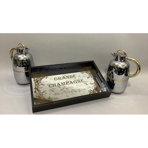 201 - A mirrored and black two-handled tray, rectangular, printed with Grande Champagne, together with two... 