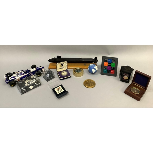 209 - Renault D Hill racing car, miniature, and a helmet, various medals, desk things, model of a submarin... 