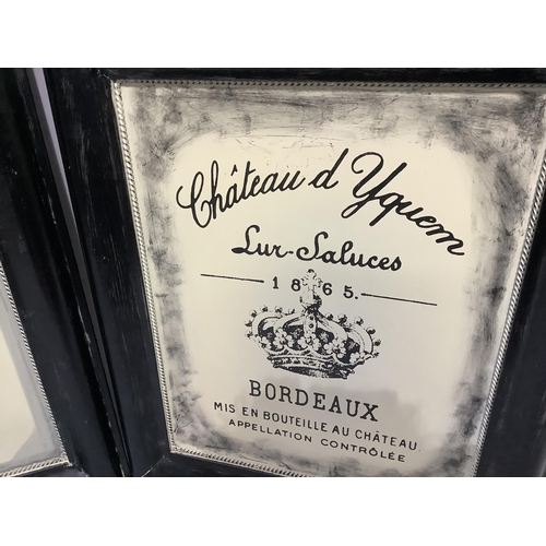 215 - A pair of black and cream pseudo advertising boards for Chateau Yquem and Chateau Palmer with pierce... 