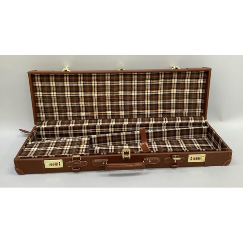 218 - A gun case in tan simulated leather with partitioned fantan interior suitable for a side by side sho... 