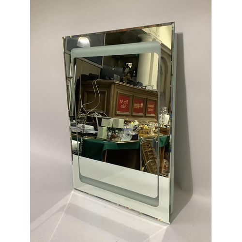 227 - A heated bathroom wall mirror, 70cm x 50cm