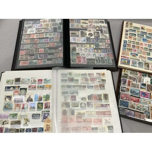 229 - Four albums of stamps, various