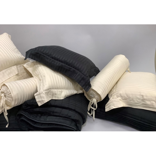 241 - A Pratesi Italian pure cotton bed set comprising a king size throw, two large black cushions and one... 