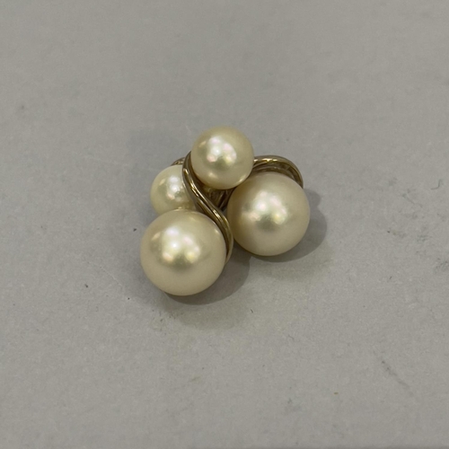 417 - A pair of cultured pearl ear studs in 9ct gold each set with 8mm and 6mm pearl, total approximate we... 