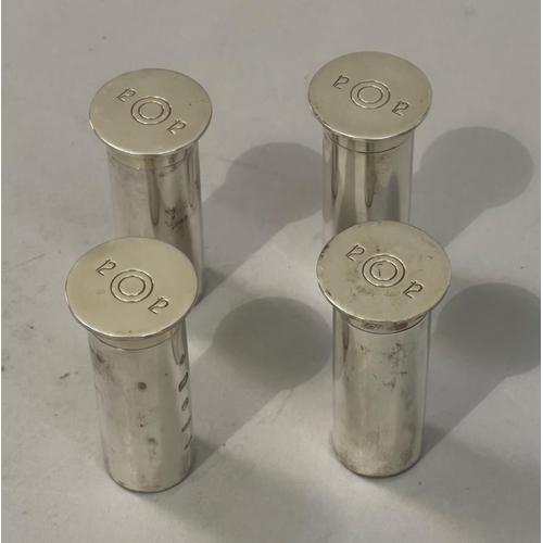 403 - Two pairs of silver salt and pepper shakers each in the form of a twelve gauge shotgun cartridge, ha... 