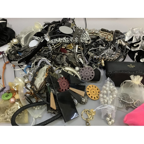 411 - A collection of costume jewellery including necklaces, key rings and bracelets variously set with po... 