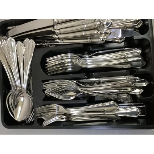 263 - A large quantity of stainless steel cutlery, approximately for sixteen, including dinner knives and ... 