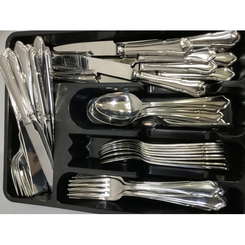 263 - A large quantity of stainless steel cutlery, approximately for sixteen, including dinner knives and ... 