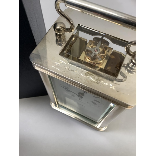 71 - A carriage  clock in silver case by Ogdens of Harrogate, Royal Hall Restoration Trust time piece wit... 