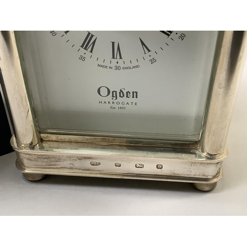 71 - A carriage  clock in silver case by Ogdens of Harrogate, Royal Hall Restoration Trust time piece wit... 