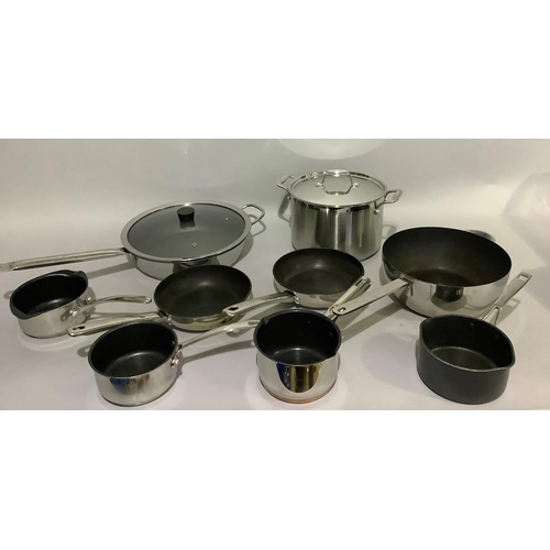 147 - A selection of stainless steel pans including a large stock pan, wok, frying pan, sauce pans, variou... 