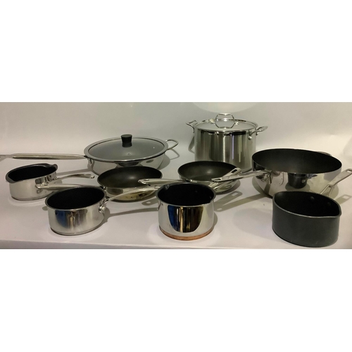 147 - A selection of stainless steel pans including a large stock pan, wok, frying pan, sauce pans, variou... 