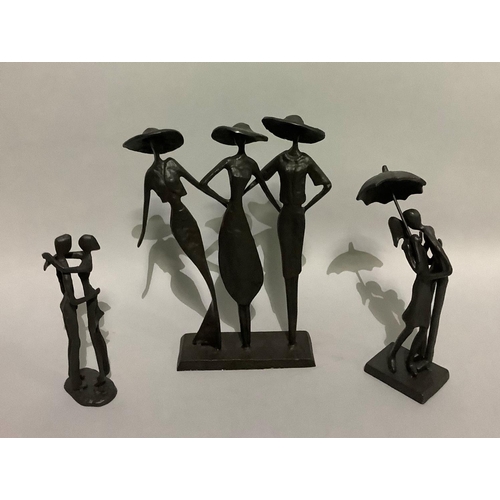 15 - Three metal sculptures of figure groups including three elegant ladies in large brimmed hats 26cm hi... 