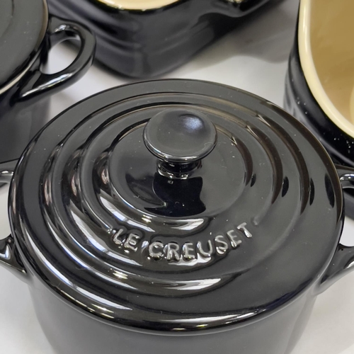 253 - A set of five Le Creuset ceramic two-handled dishes, 22.5cm over handles and four Le Creuset ceramic... 