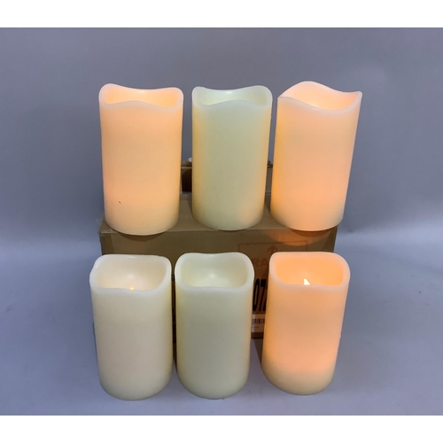 231 - A set of six large faux candle lamps with battery lights