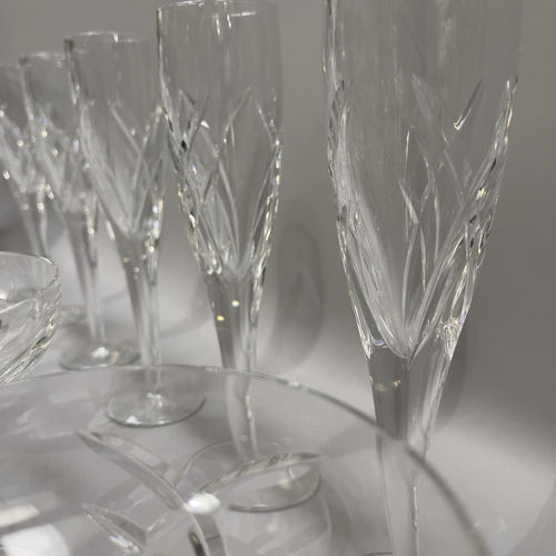 33 - A suite of twelve Waterford Champagne coupes and six matching flutes, measuring 16cm and 26cm high