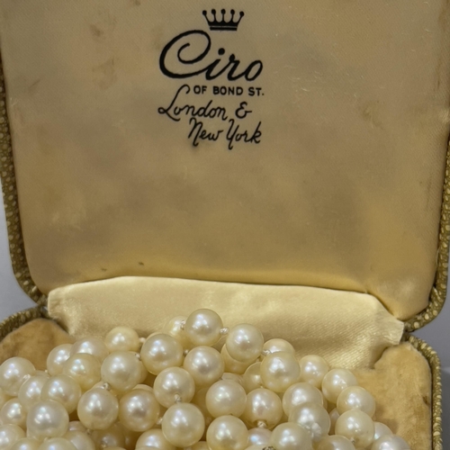 415 - A cultured pearl necklace, the three rows of 6mm diameter pearls fastened with a marcasite set silve... 