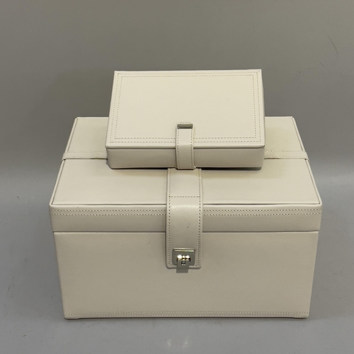 413 - Two cream leather jewellery cases by Dulwich design with cream suede interior