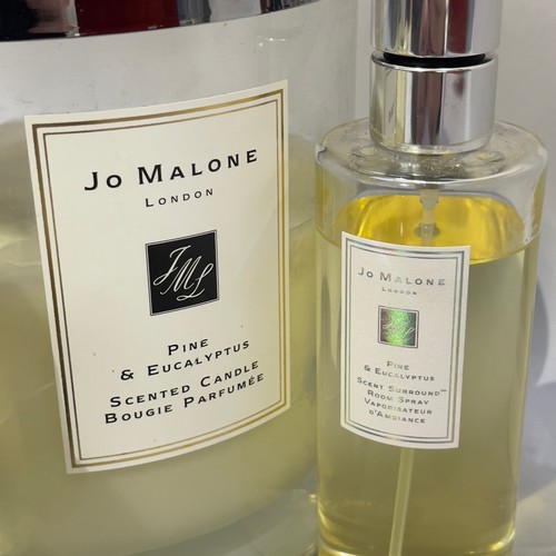 238 - Jo Malone - a set of six candles in a chrome stand, two Pine & Eucalyptus candles, unused, two 2.1kg... 