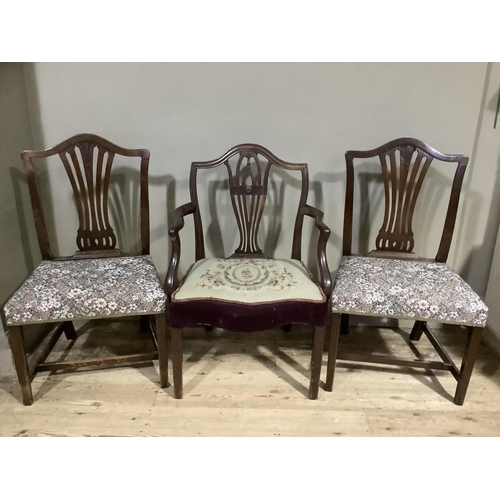 165 - An Edwardian mahogany elbow chair with arched back and pierced splat, needlework seat on square tape... 