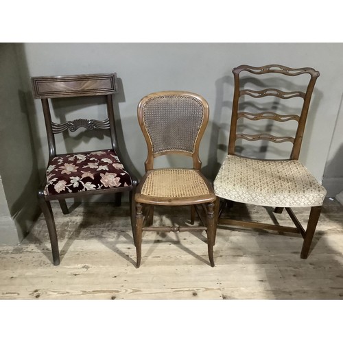 165 - An Edwardian mahogany elbow chair with arched back and pierced splat, needlework seat on square tape... 