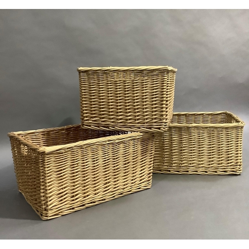 307 - A set of three wicker baskets, 59cm x 44cm x 30cm high