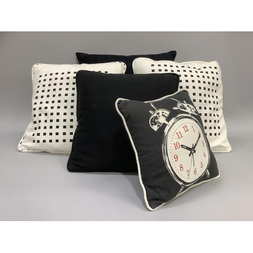 316 - Five various cushions including two black in graduated size, a pair of white and black and a small c... 