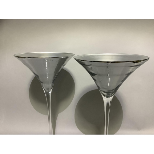 322 - A pair of silvered and clear glass outsize cocktail glasses, 70cm high x 32cm diameter