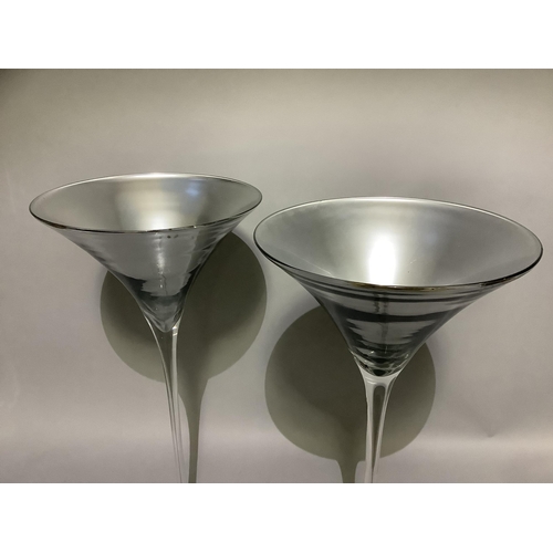 322 - A pair of silvered and clear glass outsize cocktail glasses, 70cm high x 32cm diameter