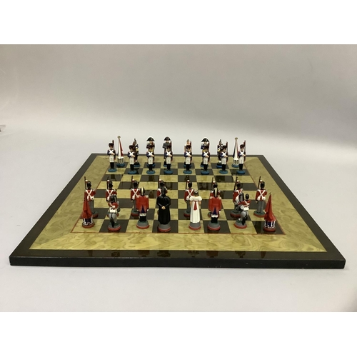 348 - A chess set of Napoleon & Wellington figures and a chess board