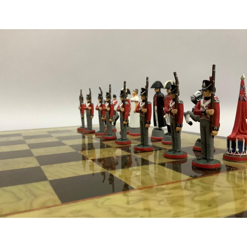 348 - A chess set of Napoleon & Wellington figures and a chess board