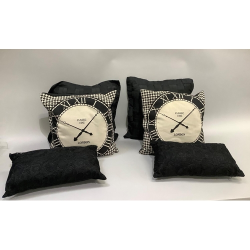 354 - Cushions including two beige and black clock face cushions, a pair of black silky cushions and two b... 