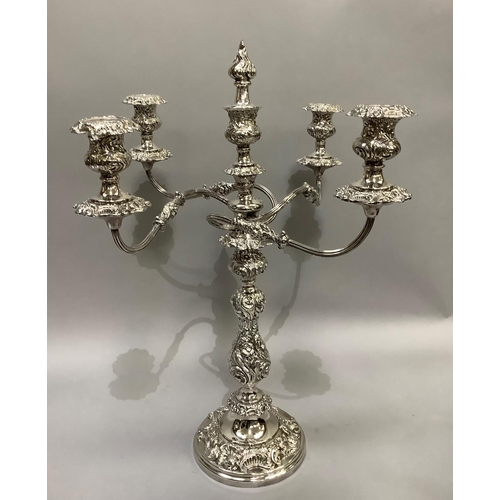 366 - A quality silver plated five light candelabra having a central baluster and foliate embossed single ... 