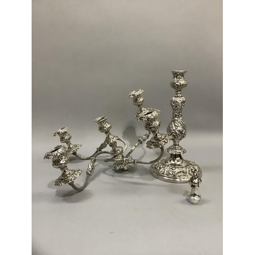 366 - A quality silver plated five light candelabra having a central baluster and foliate embossed single ... 