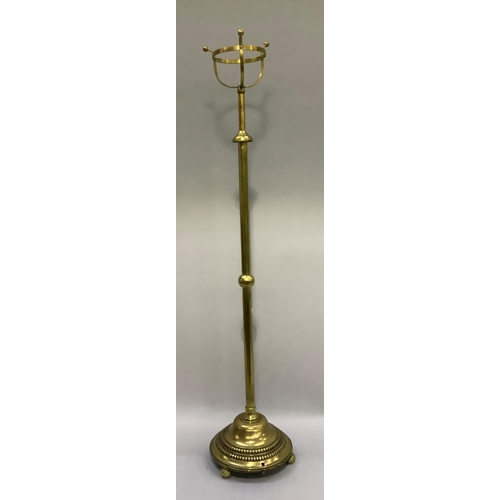 367 - An early 20th century brass standard oil lamp having a basket top for the reservoir, telescopic colu... 