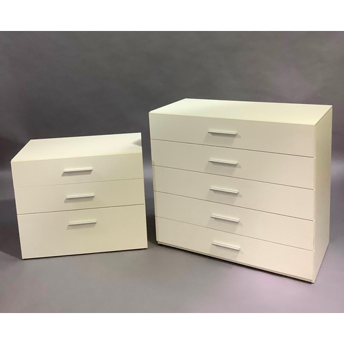 434 - Two cream chests of drawers with brushed steel bar handles, each of three heights and measuring 100c... 