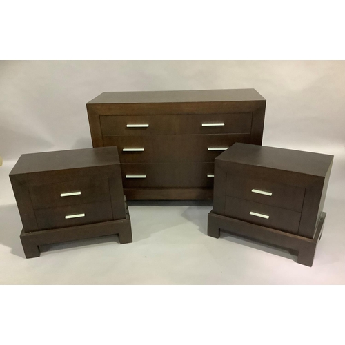 445 - A suite of dark stained bedroom furniture comprising a three drawer chest and pair of two drawer bed... 