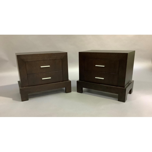 445 - A suite of dark stained bedroom furniture comprising a three drawer chest and pair of two drawer bed... 