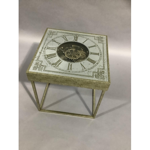 454 - A gilt metal and mirrored clock face side table on square legs, 51cm square x 51cm high