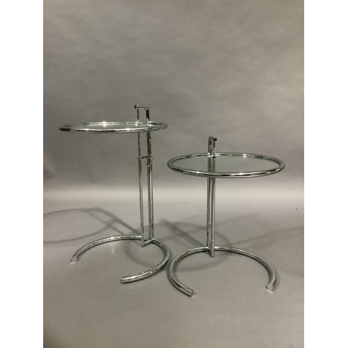 458 - A pair of chrome and glass circular occasional tables on telescopic stands and curved foot, 51cm dia... 