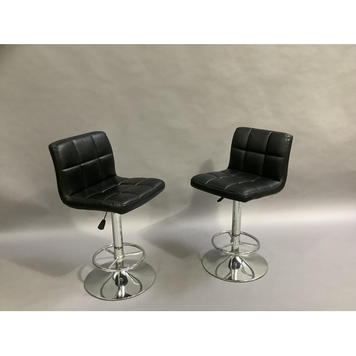 459 - A pair of black faux leather and chrome bar chairs