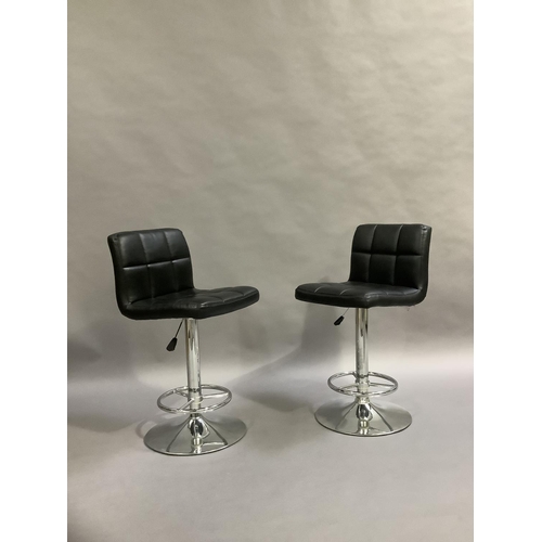 459 - A pair of black faux leather and chrome bar chairs