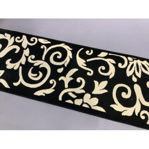 460 - A black and cream runner, 230cm x 60cm