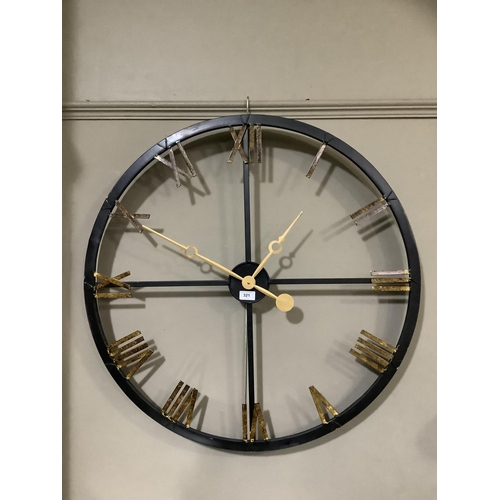 321 - A black and gilt skeletal wall clock with Roman numerals, 82cm diameter