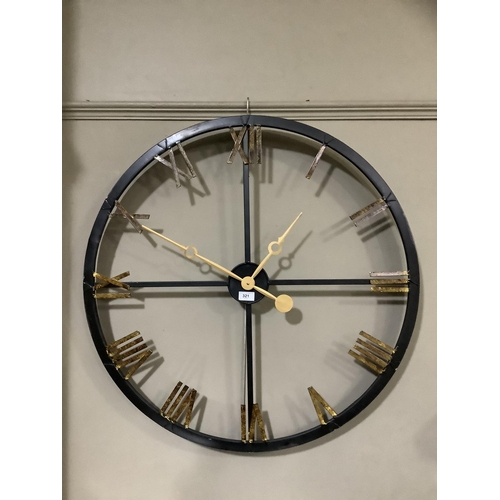 321 - A black and gilt skeletal wall clock with Roman numerals, 82cm diameter