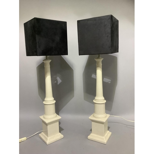 330 - Two white pottery column table lamps on square bases and with black square shades, overall height wi... 