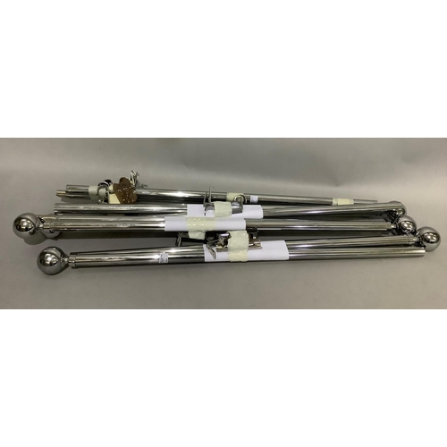 369 - A set of four chrome curtain poles with spherical ends, adjustable, maximum length between finials a... 