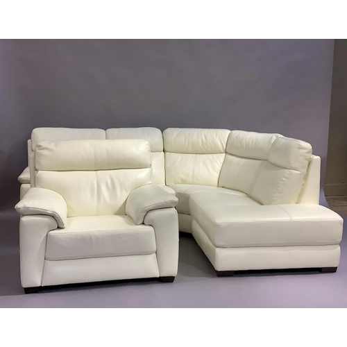 461 - A cream leather corner sofa in three sections, and a matching armchair, all on dark stained block fe... 